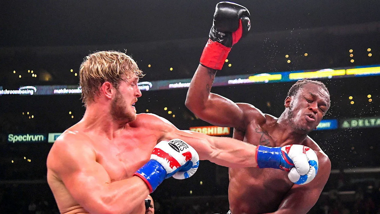 Logan Paul and KSI trading punches in the ring during their landmark fight, the bout widely credited with launching influencer boxing into mainstream popularity.