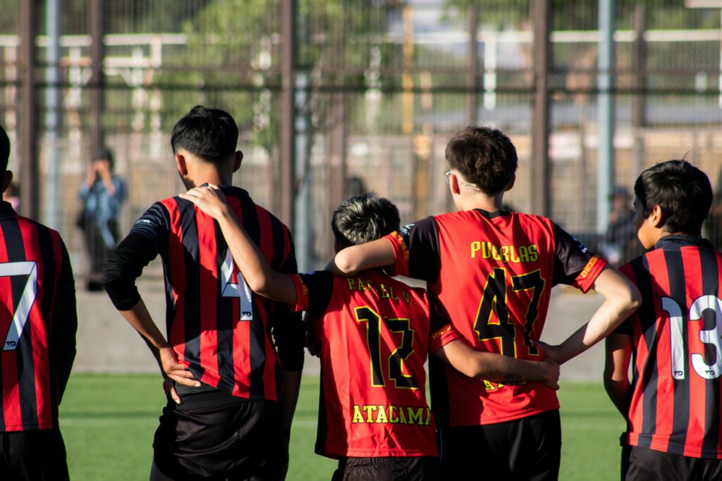 youth football players standing together before a match