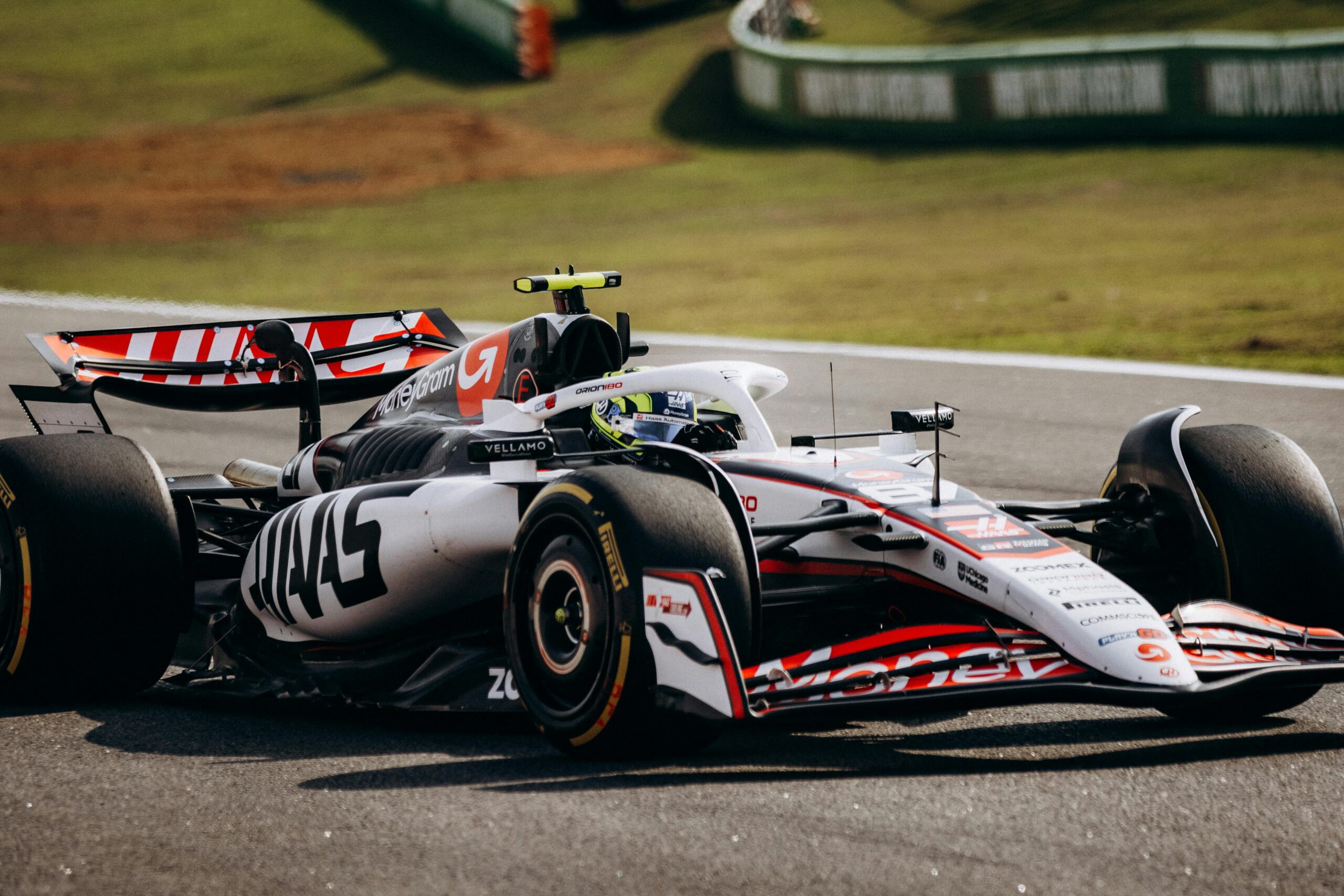 Haas Formula One car navigating a circuit during a Grand Prix