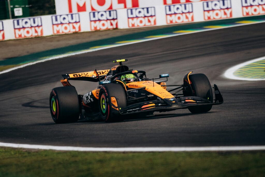 McLaren Formula One car racing through a high speed corner