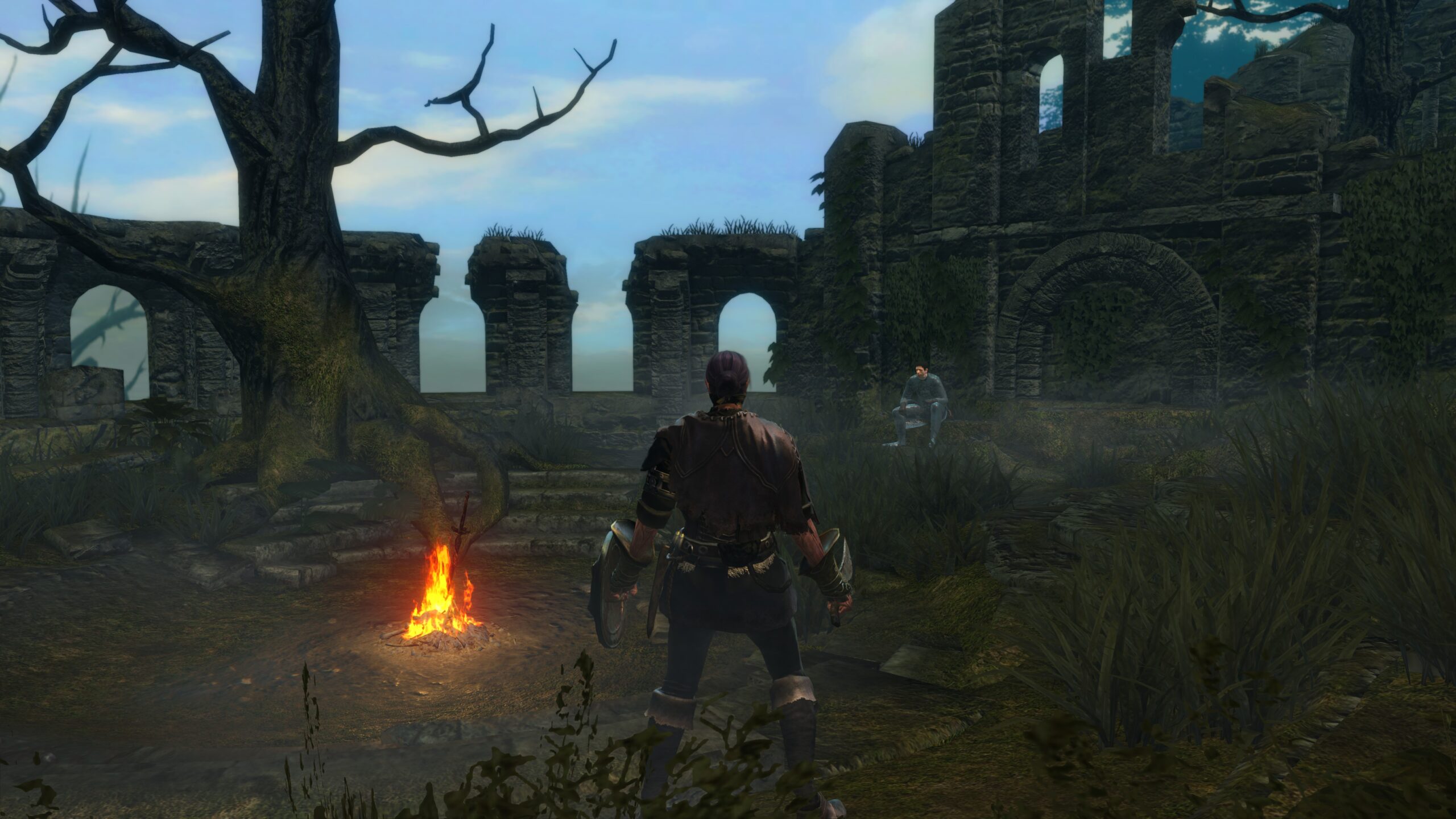 Player character stands near a bonfire in Dark Souls ruins environment.