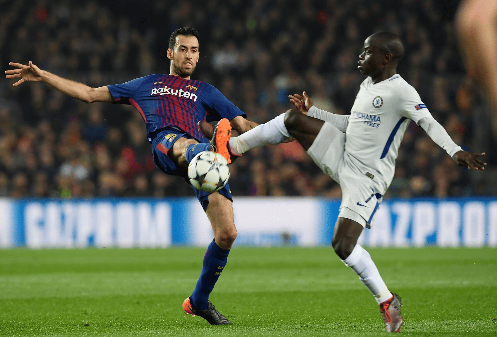 Barcelona and Chelsea players challenge for the ball during a UEFA Champions League match