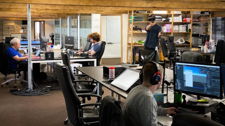 Video game developers working in a modern office