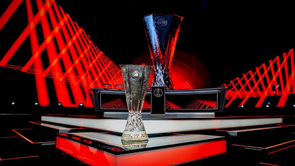 UEFA Europa League trophy displayed on stage with red lighting during official presentation