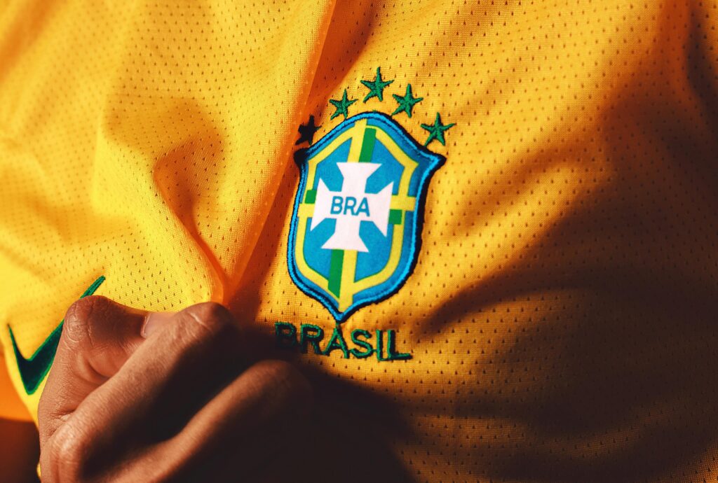 yellow Brazil football team shirt with close up of badge