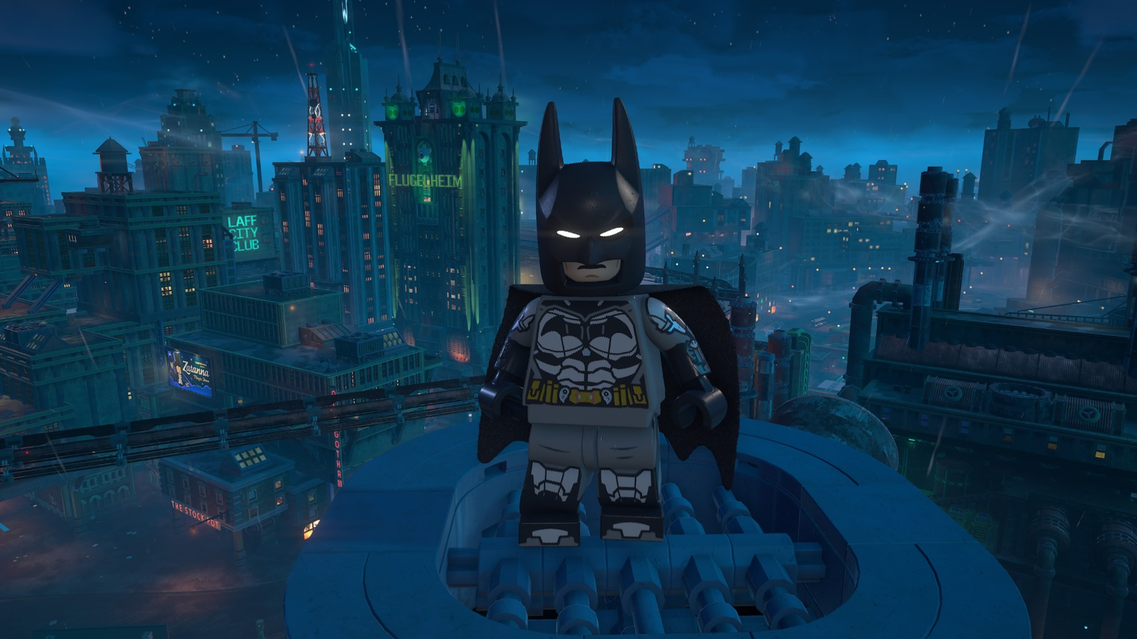 Batman overlooking Gotham City at night in LEGO Batman Legacy of the Dark Knight